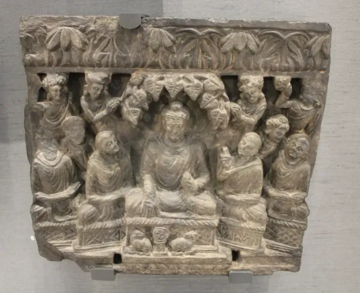 Buddha's first sermon — Gandhara relief, second to third century CE, British Museum