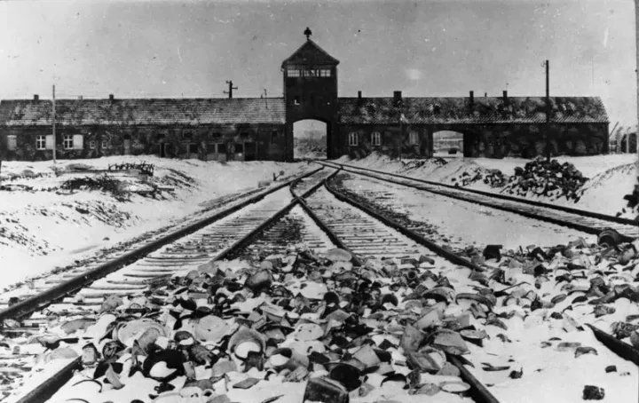 The entrance gate to Auschwitz-Birkenau concentration and extermination camp, 1945 — Bundesarchiv