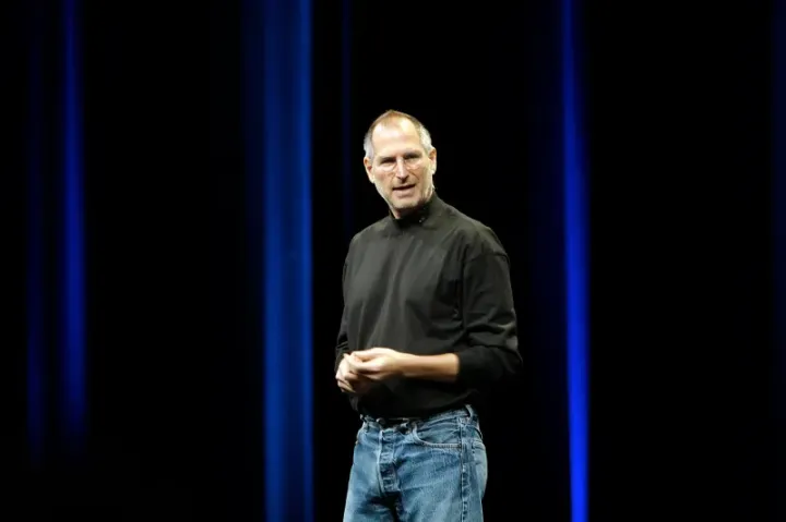 Steve Jobs holding the original iPhone at the Macworld keynote, January 2007