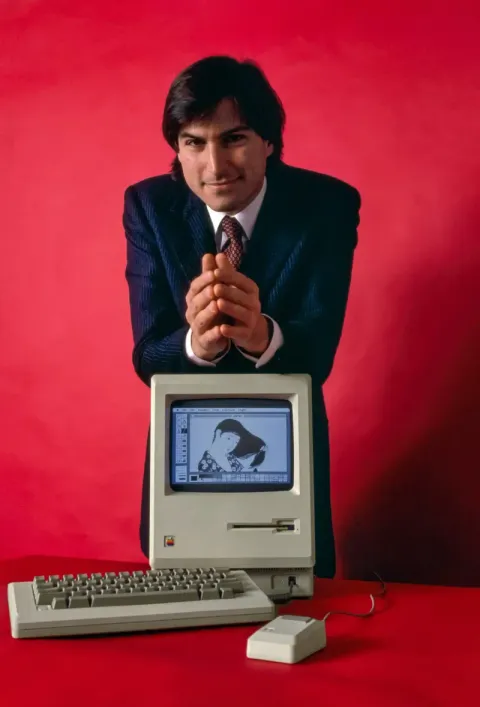 Steve Jobs unveiling the original Macintosh at the Apple shareholders meeting, January 1984