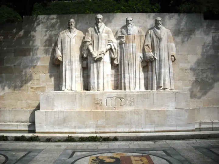 The Reformation Wall in Geneva — statues of Farel, Calvin, Beza, and Knox